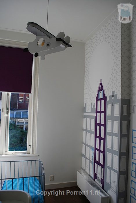Kinderkamer blauw paars babykamer vliegtuig